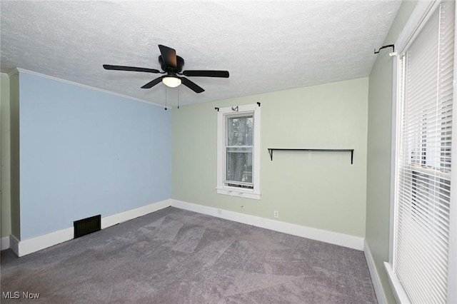858 11th St NE, Massillon, OH 44646 - carpeted empty room with a ceiling fan and a textured ceiling