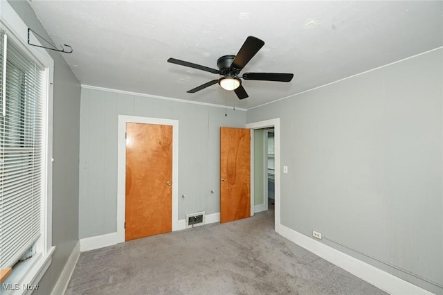 858 11th St NE, Massillon, OH 44646 - unfurnished bedroom with carpet flooring and ceiling fan