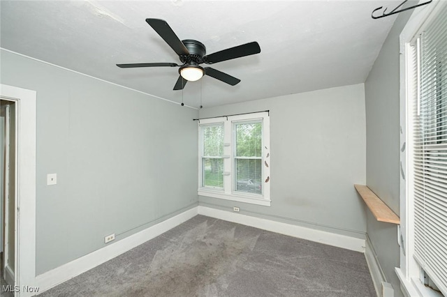 858 11th St NE, Massillon, OH 44646 - unfurnished bedroom with carpet flooring and ceiling fan