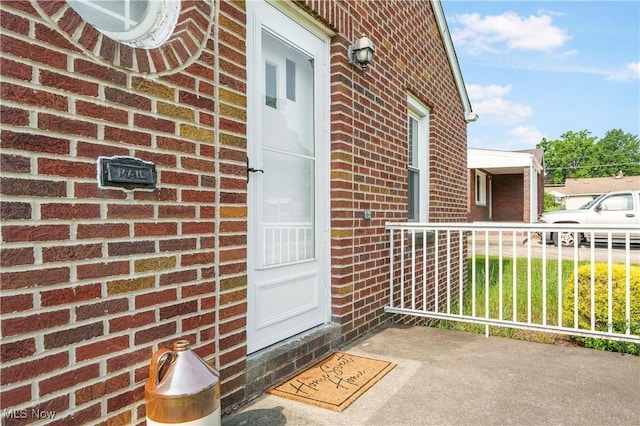 230 Hamilton Blvd, Struthers, OH 44471 - doorway to property featuring brick siding