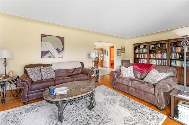 230 Hamilton Blvd, Struthers, OH 44471 - living area with arched walkways and wood finished floors