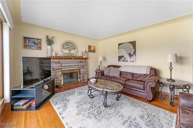 230 Hamilton Blvd, Struthers, OH 44471 - living area featuring a stone fireplace and wood finished floors