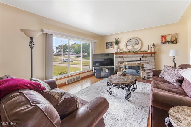 230 Hamilton Blvd, Struthers, OH 44471 - living room with wood finished floors and a stone fireplace