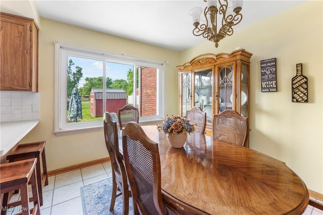 230 Hamilton Blvd, Struthers, OH 44471 - dining space featuring a chandelier and light tile patterned floors