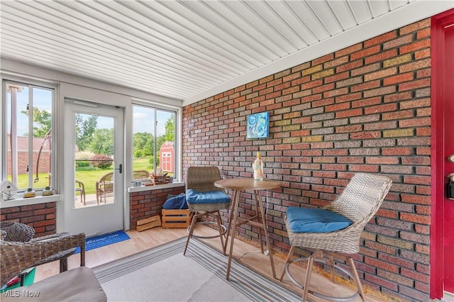 230 Hamilton Blvd, Struthers, OH 44471 - sunroom / solarium with brick wall and wood finished floors