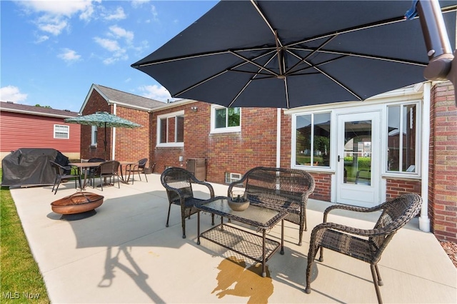 230 Hamilton Blvd, Struthers, OH 44471 - view of patio featuring area for grilling and an outdoor living space with a fire pit