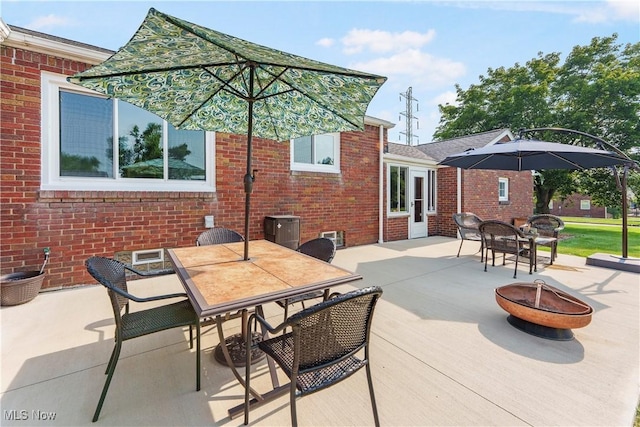 230 Hamilton Blvd, Struthers, OH 44471 - view of patio / terrace featuring a fire pit and outdoor dining area