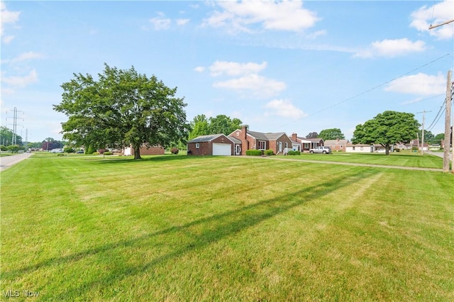 230 Hamilton Blvd, Struthers, OH 44471 - view of grassy yard featuring a garage