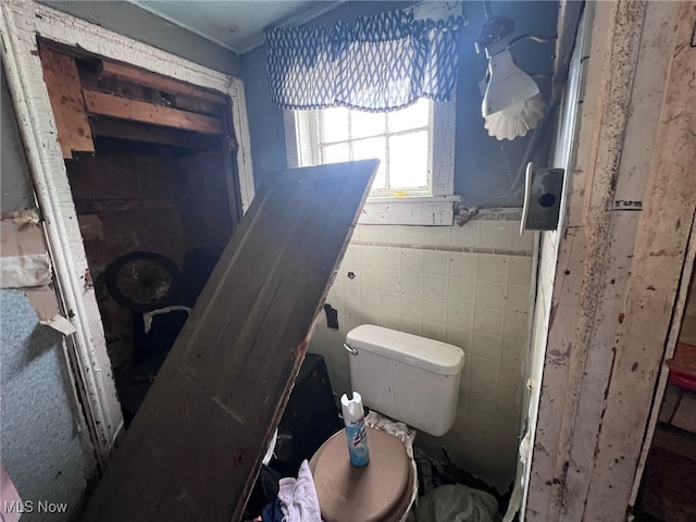 1055 E 78th St, Cleveland, OH 44103 - bathroom with toilet and tile walls