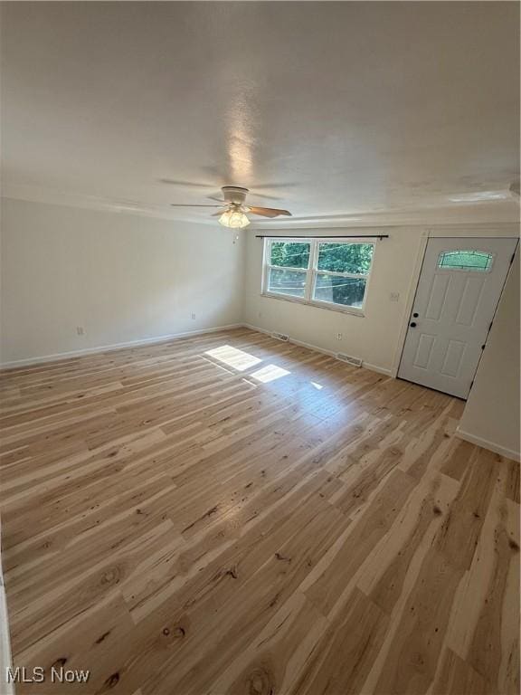 3627 Marland Heights Rd, Weirton, WV 26062 - unfurnished living room with light wood-type flooring, ceiling fan, and crown molding