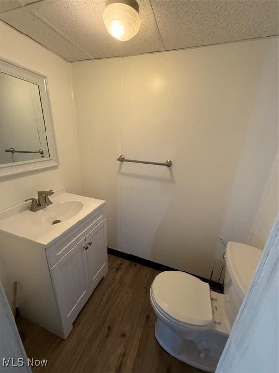 3627 Marland Heights Rd, Weirton, WV 26062 - half bath with vanity, wood finished floors, and a drop ceiling
