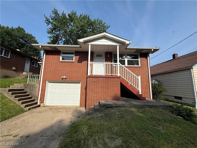 3627 Marland Heights Rd, Weirton, WV 26062 - view of front of house featuring stairway, brick siding, concrete driveway, and a garage
