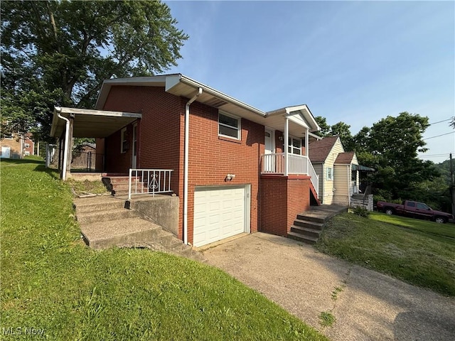 3627 Marland Heights Rd, Weirton, WV 26062 - view of front facade featuring driveway, brick siding, a front lawn, and a garage