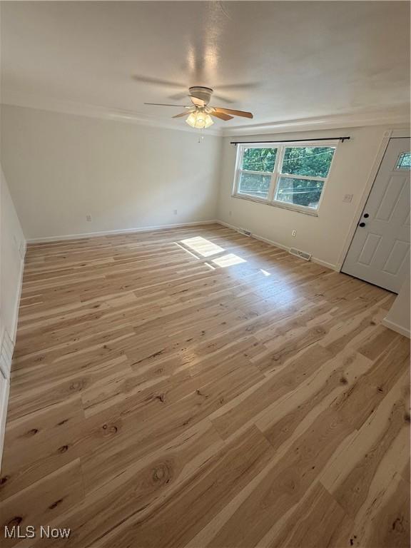 3627 Marland Heights Rd, Weirton, WV 26062 - unfurnished room with light wood-style flooring, ceiling fan, and crown molding