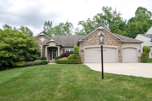 8311 Hemingway Ln, Mentor, OH 44060 - view of front of home featuring stone siding, an attached garage, driveway, a front yard, and a shingled roof