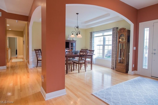 8311 Hemingway Ln, Mentor, OH 44060 - foyer entrance featuring arched walkways and light wood-style floors