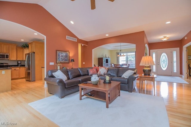 8311 Hemingway Ln, Mentor, OH 44060 - living area featuring arched walkways, light wood-style floors, ceiling fan, recessed lighting, and a chandelier