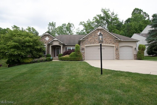 8311 Hemingway Ln, Mentor, OH 44060 - view of front facade with a garage, driveway, a front yard, and stone siding