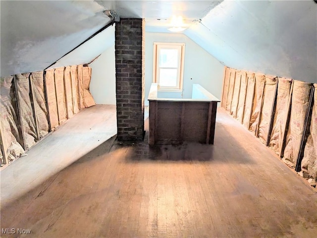 173 6th St SW, Brewster, OH 44613 - bonus room with hardwood / wood-style flooring and lofted ceiling
