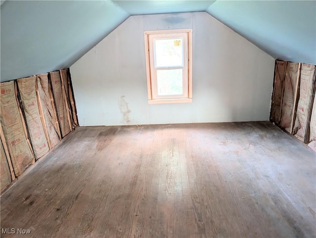 173 6th St SW, Brewster, OH 44613 - additional living space with wood finished floors and lofted ceiling