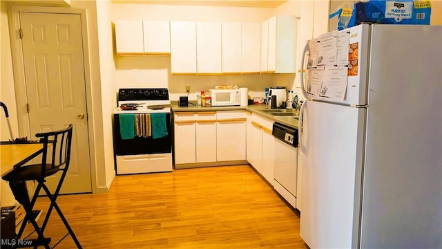 37 Alaska Ave, Chester, WV 26034 - kitchen featuring white appliances, light wood-type flooring, and white cabinetry