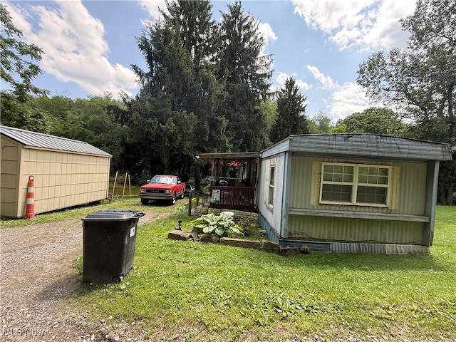 51 Buckeye Dr, New Cumberland, WV 26047 - view of green lawn featuring an outbuilding