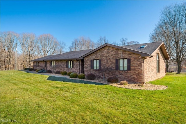 52 Hilda Cir, Bloomingdale, OH 43910 - view of front of house with a front yard, brick siding, and roof with shingles