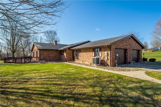 52 Hilda Cir, Bloomingdale, OH 43910 - ranch-style house featuring brick siding, a front lawn, a chimney, and a garage
