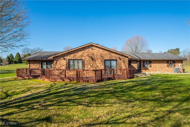 52 Hilda Cir, Bloomingdale, OH 43910 - rear view of house with a lawn, a deck, and brick siding