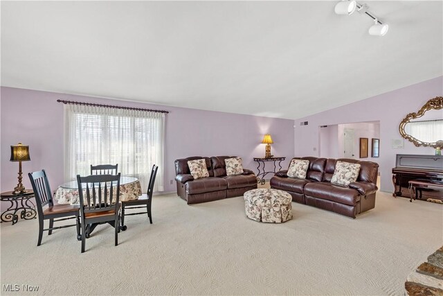 52 Hilda Cir, Bloomingdale, OH 43910 - living room featuring light colored carpet, lofted ceiling, and rail lighting