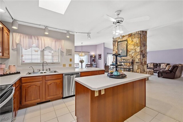 52 Hilda Cir, Bloomingdale, OH 43910 - kitchen featuring stainless steel appliances, track lighting, light tile patterned flooring, light countertops, and brown cabinetry