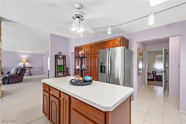 52 Hilda Cir, Bloomingdale, OH 43910 - kitchen featuring stainless steel refrigerator with ice dispenser, ceiling fan, a kitchen island, light countertops, and vaulted ceiling