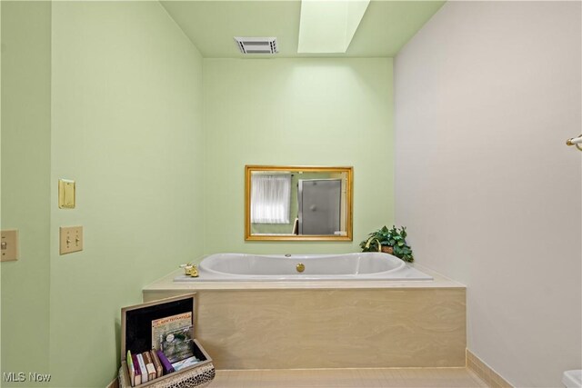 52 Hilda Cir, Bloomingdale, OH 43910 - bathroom with a garden tub and baseboards