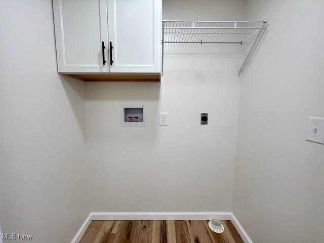 619 N 3rd St, Dennison, OH 44621 - laundry area featuring washer hookup, hookup for an electric dryer, wood finished floors, and cabinet space