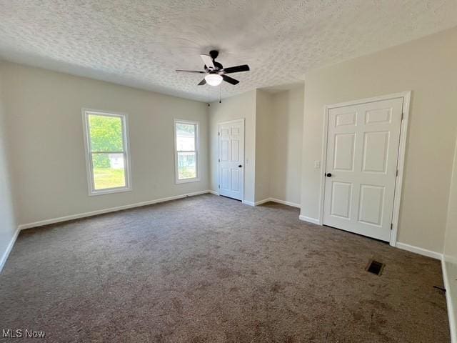 619 N 3rd St, Dennison, OH 44621 - unfurnished bedroom with carpet floors, a textured ceiling, a ceiling fan, and a closet