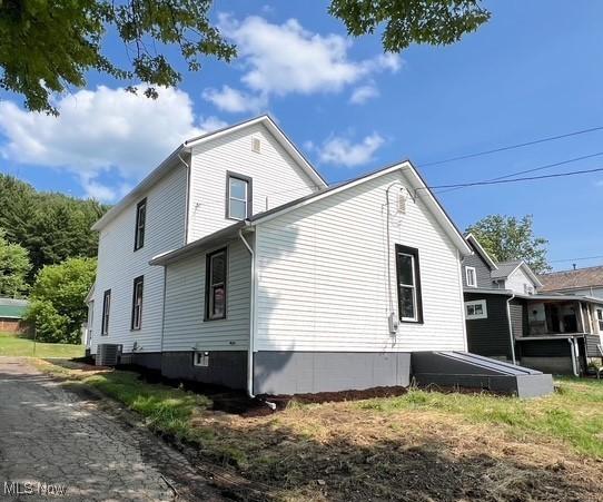 619 N 3rd St, Dennison, OH 44621 - view of property exterior with a central air condition unit