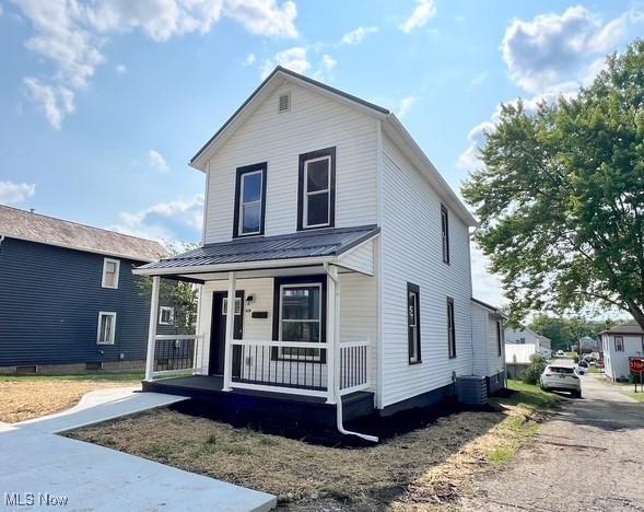 619 N 3rd St, Dennison, OH 44621 - view of front of property with covered porch and a metal roof