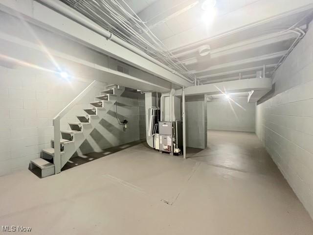 619 N 3rd St, Dennison, OH 44621 - unfinished basement featuring concrete block wall and stairway