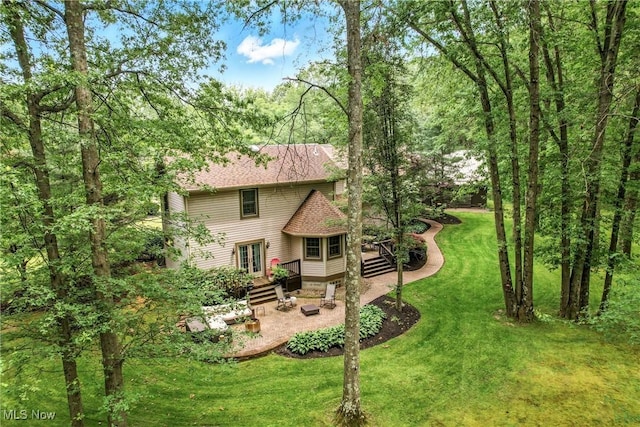 1681 State Rd, Warren, OH 44481 - back of house with french doors, a patio area, a yard, a deck, and roof with shingles