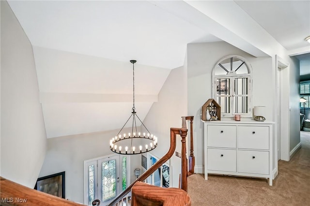 1681 State Rd, Warren, OH 44481 - hallway with an upstairs landing, light colored carpet, healthy amount of natural light, a chandelier, and lofted ceiling