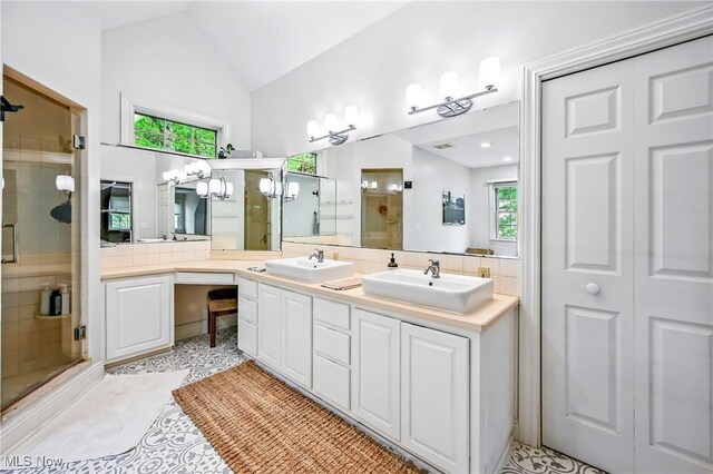 1681 State Rd, Warren, OH 44481 - full bath with a stall shower, double vanity, and lofted ceiling