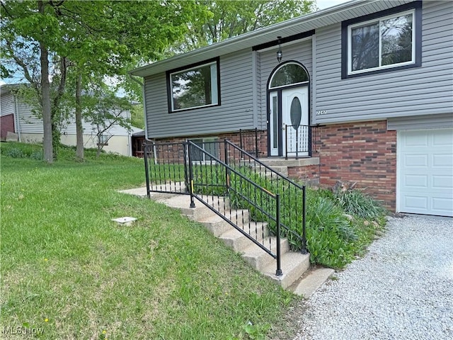 7247 Kiltie Ln, Northfield, OH 44067 - view of front of home with a front lawn, a garage, and brick siding