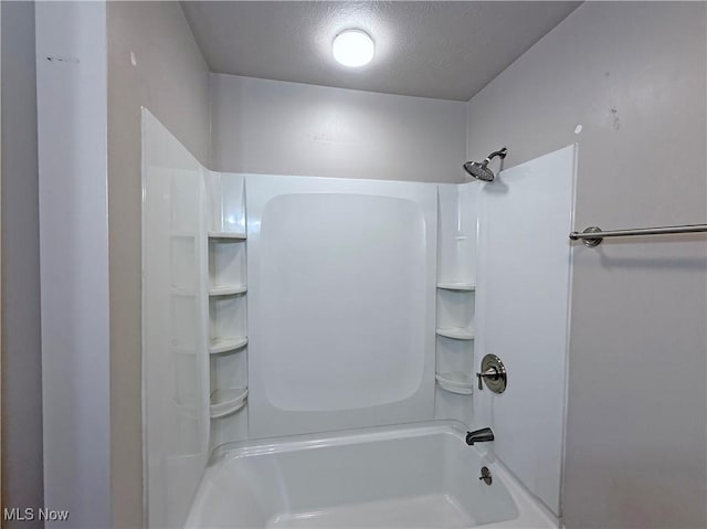 7247 Kiltie Ln, Northfield, OH 44067 - bathroom featuring  shower combination and a textured ceiling