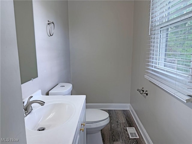 7247 Kiltie Ln, Northfield, OH 44067 - half bathroom with wood finished floors and vanity
