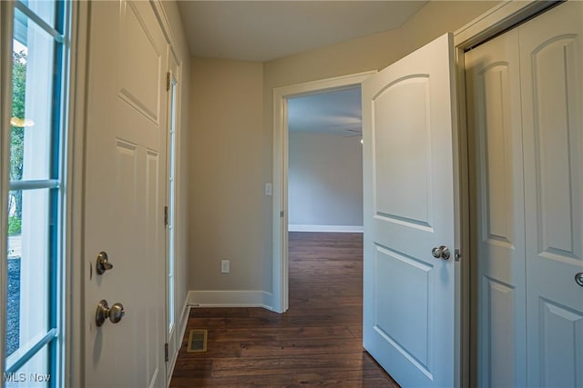 583 Creedmore Ave, Barberton, OH 44203 - hallway featuring dark wood-style floors and baseboards