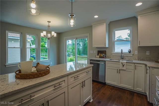 583 Creedmore Ave, Barberton, OH 44203 - kitchen featuring dishwasher, white cabinetry, dark wood-style floors, a chandelier, and light stone countertops