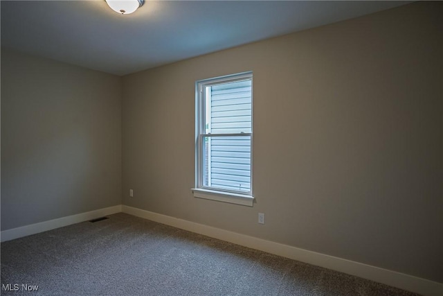 583 Creedmore Ave, Barberton, OH 44203 - unfurnished room with dark colored carpet
