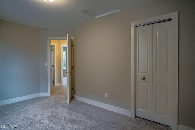 583 Creedmore Ave, Barberton, OH 44203 - unfurnished bedroom featuring carpet, a closet, and attic access