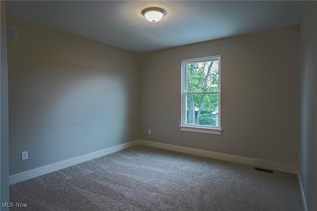 583 Creedmore Ave, Barberton, OH 44203 - unfurnished room featuring carpet floors
