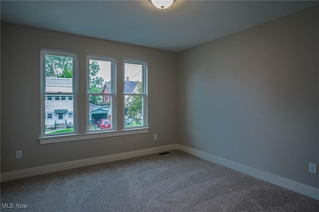583 Creedmore Ave, Barberton, OH 44203 - carpeted spare room featuring baseboards